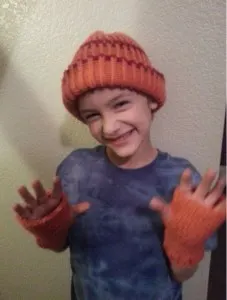 Jared with his new hat & fingerless mittens