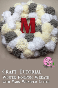 Make your own Winter PomPom Wreath and bring the snow inside. The fluffy pompom snowballs surround your yarn-wrapped initial. https://www.goodknitkisses.com/winter-pom-pom-wreath/ #goodknitkisses #pompom #pompomwreath #pompomcrafts #winterwreath