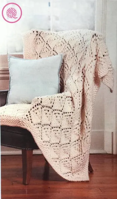 How to Knit Lace - Winter Lace Afghan draped on a chair