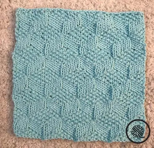 knit tumbling moss blocks washcloth pattern finished project in blue
