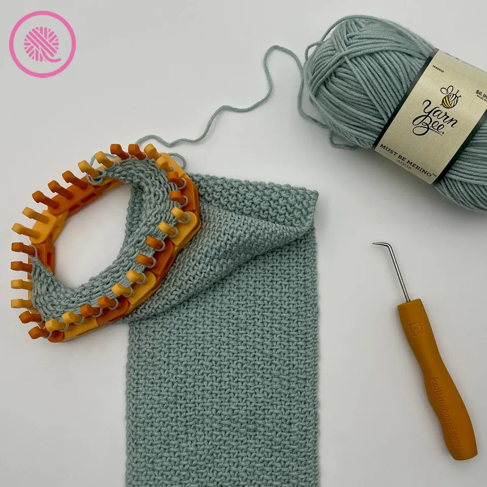 loom knit linen scarf in progress with yarn ball